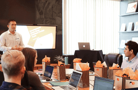 ES team conducting a software development outsourcing meeting with clients.